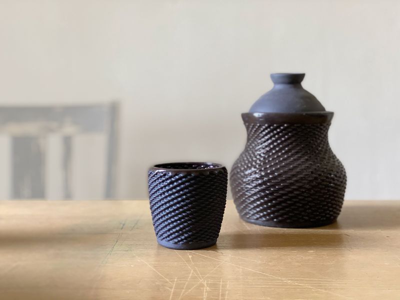 Two POTTERWARE-designed forms on a table